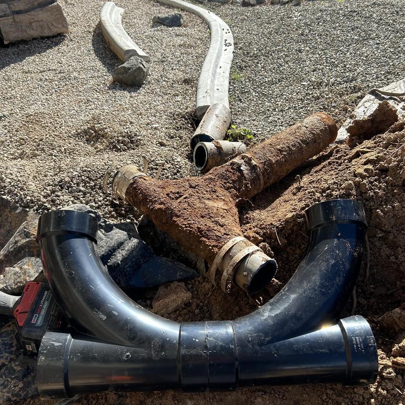 Drain line pipe replacement with cast-iron and ABS fittings