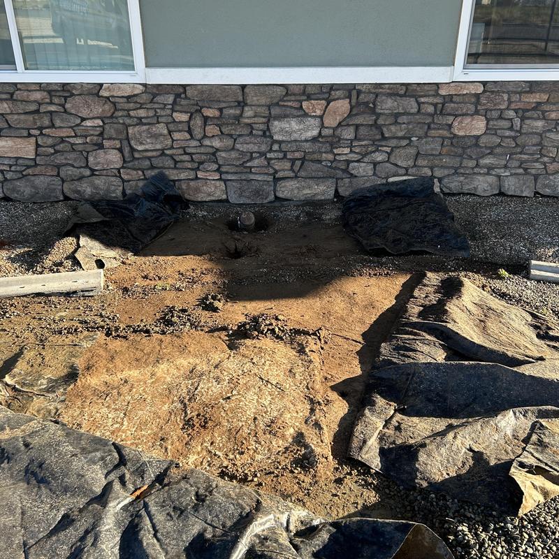 Drain line excavation and clean out installation in yard