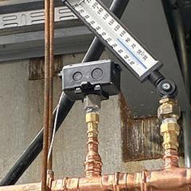 Water heater hot line piping and temperature gauge installation