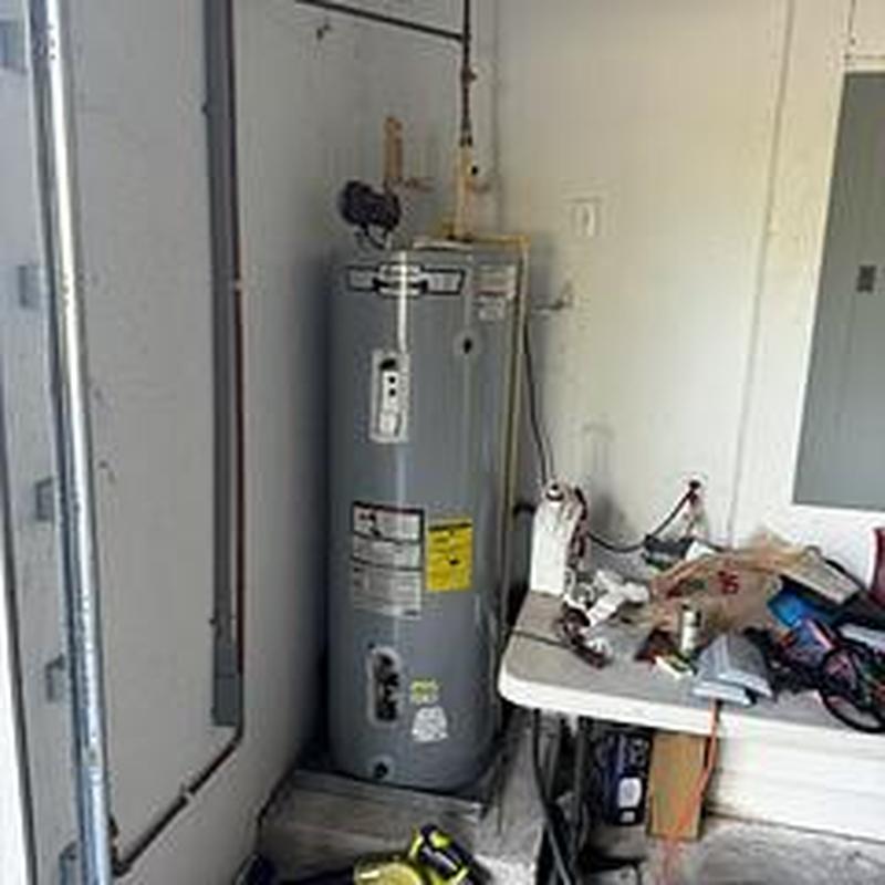 Rheem 50-gallon water heater installation in utility room