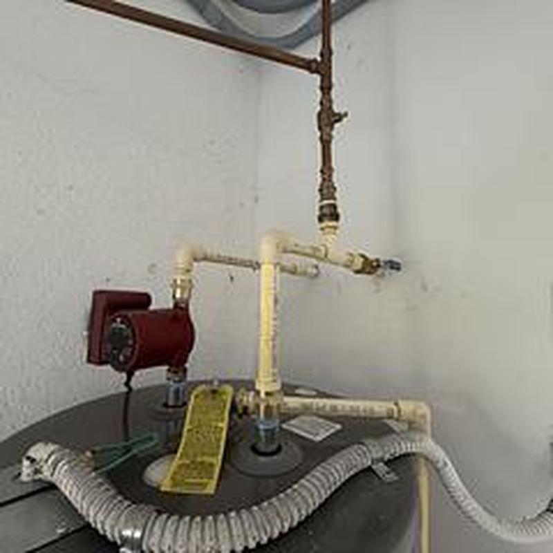 Rheem 50-gallon water heater with piping and valves