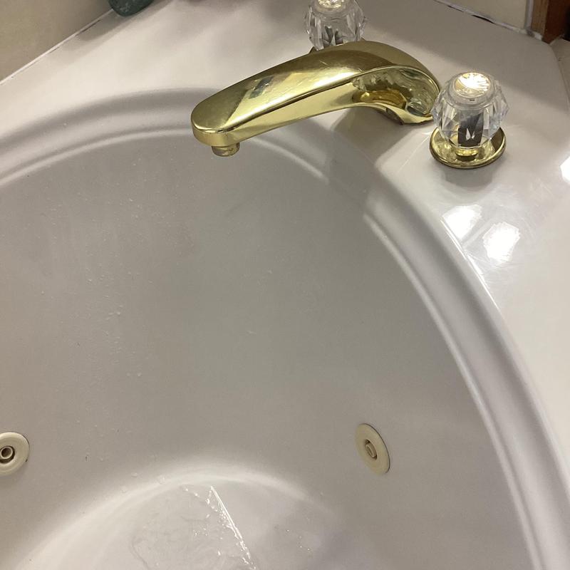 Delta garden tub faucet with gold finish and knobs