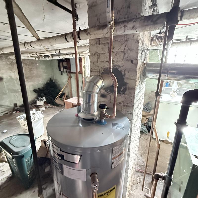 Gas water heater vent pipe and plumbing connections