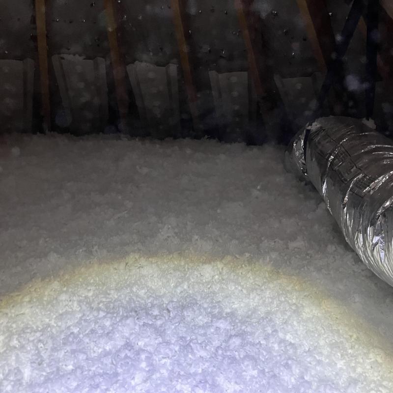 Attic insulation installed over joists with ductwork