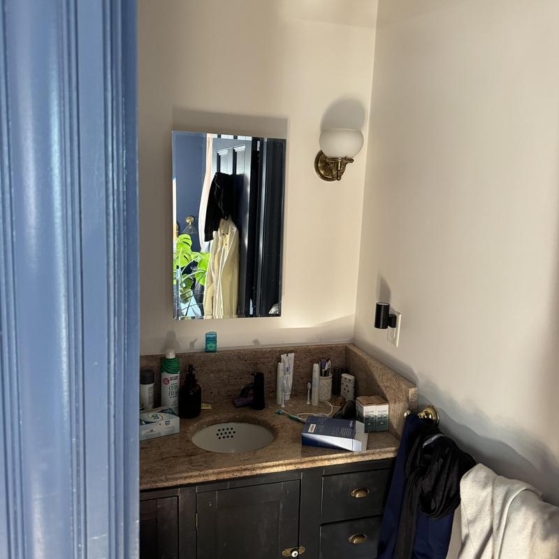 Bathroom sink and granite countertop with mirror