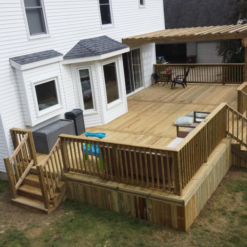 Custom treated wooden deck with pergola installation Custom treated wooden deck with pergola installation
