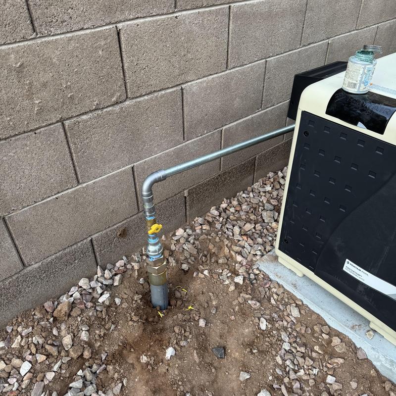 Pool heater gas line installation beside wall