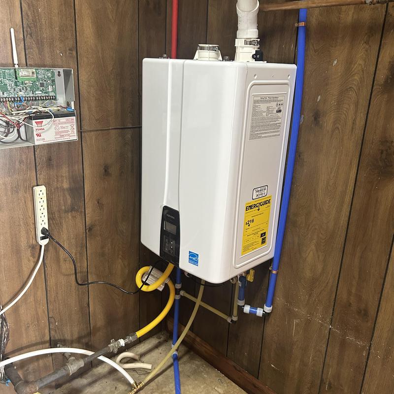 Tankless gas water heater installation with piping