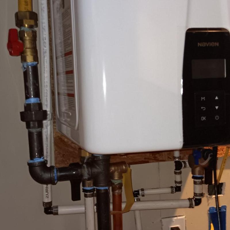 Navien tankless water heater with piping connections