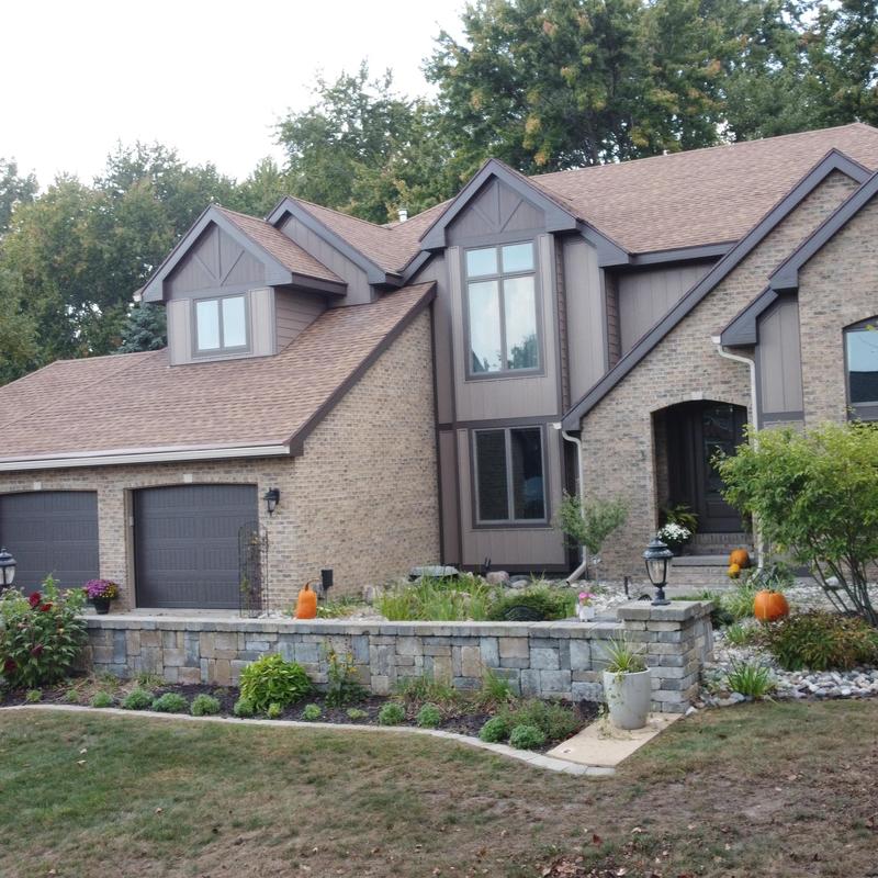 Vinyl siding and composite trim installation on home exterior Vinyl siding and composite trim installation on home exterior