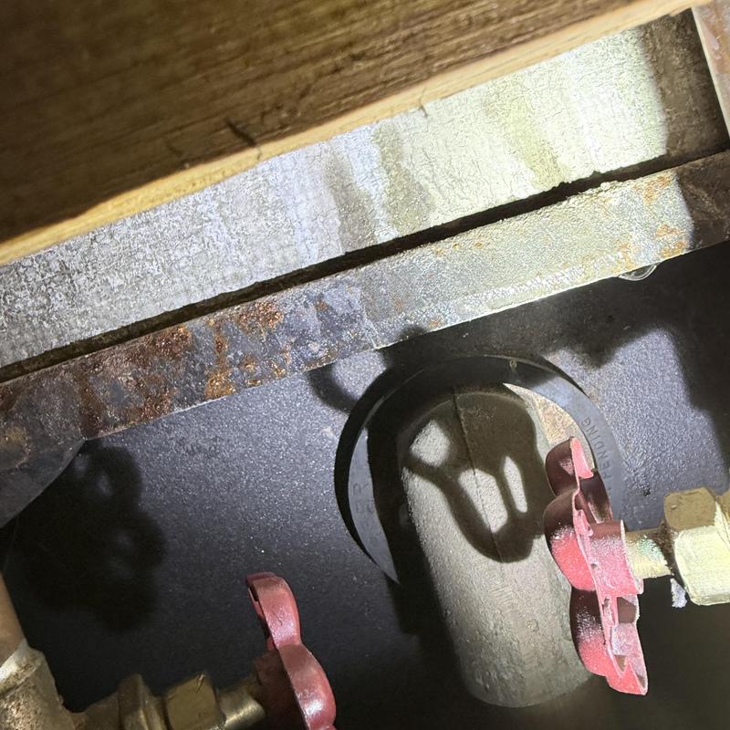 Shower valve with red handles and pipe connection