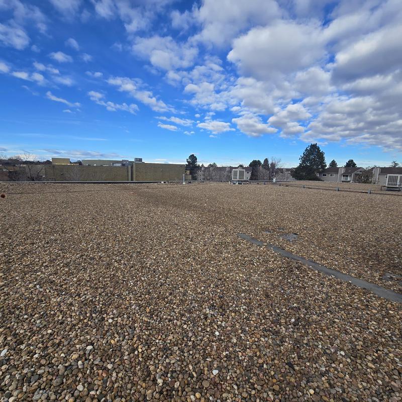 EPDM ballasted flat roof with peeling seams EPDM ballasted flat roof with peeling seams