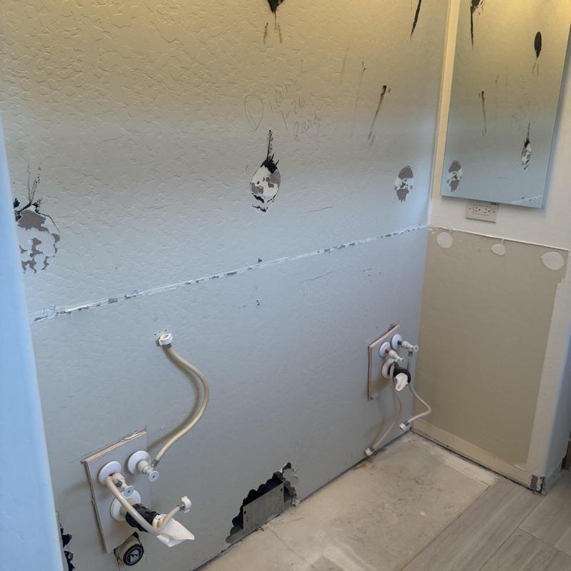In-wall faucet plumbing and vanity wall repair
