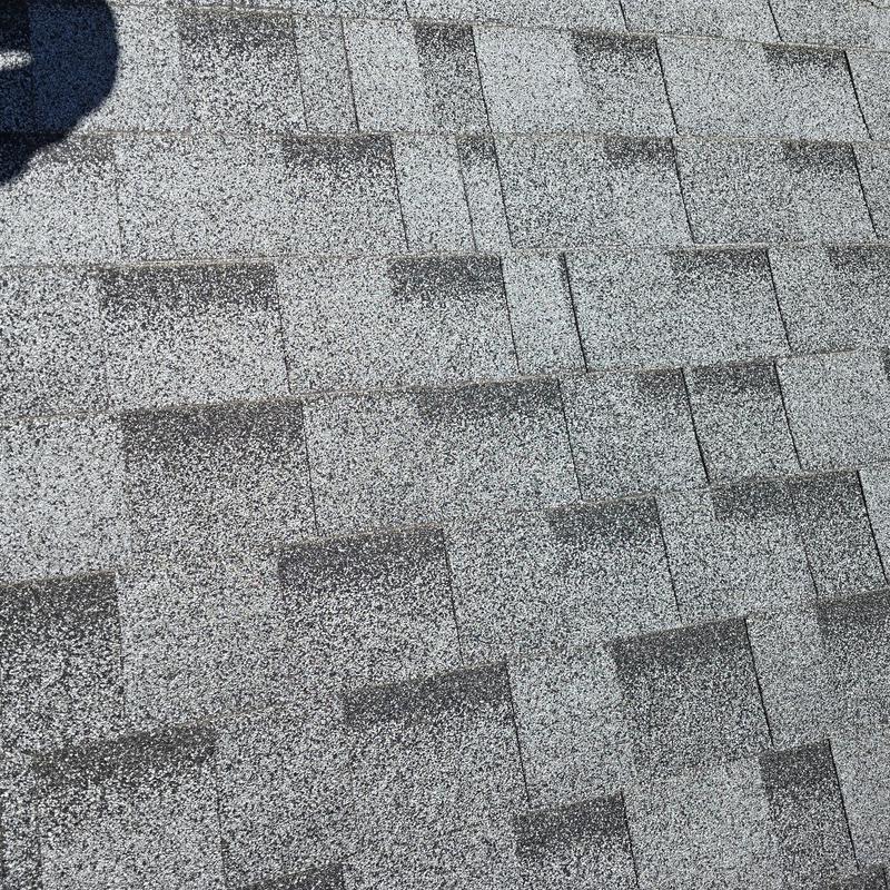 Asphalt shingle roof surface close-up in good condition Asphalt shingle roof surface close-up in good condition