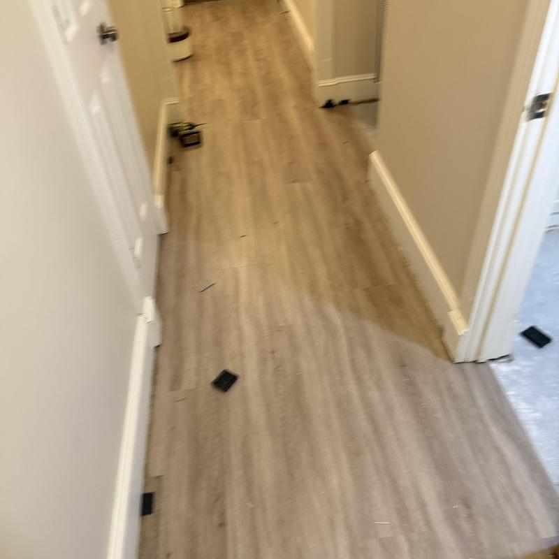 Vinyl plank flooring prep in narrow hallway Vinyl plank flooring prep in narrow hallway