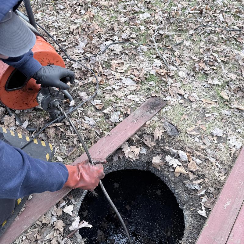 Main sewer line cleaning with drain snake outside