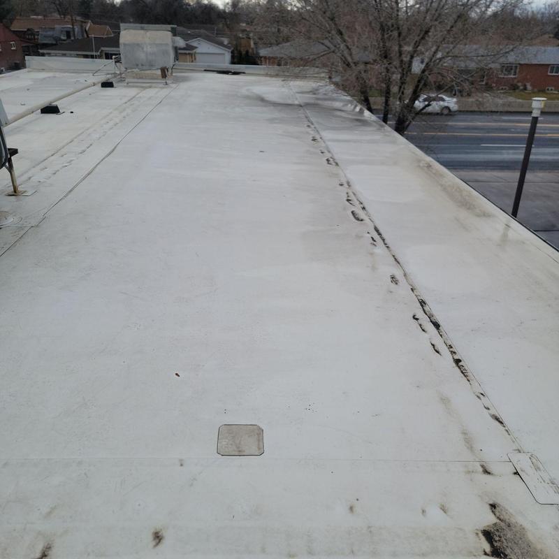 TPO flat roof with seam repairs and patching TPO flat roof with seam repairs and patching