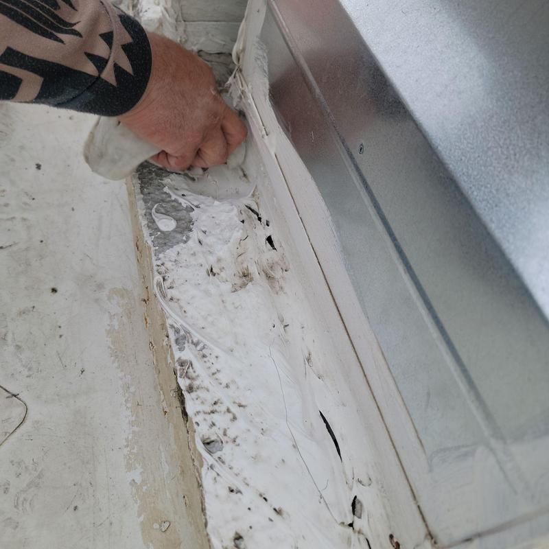 TPO roof leak patching near metal flashing edge TPO roof leak patching near metal flashing edge