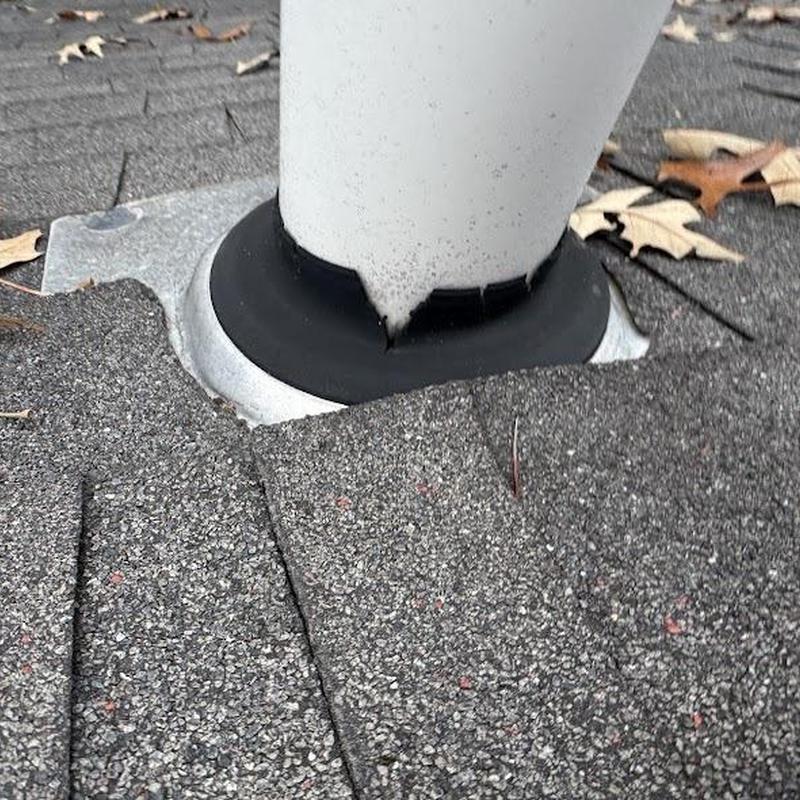 Pipe boot flashing on roof shingles with repaired seal