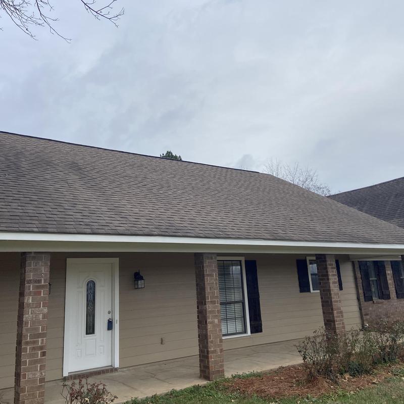 Asphalt shingle roof with repaired missing shingles