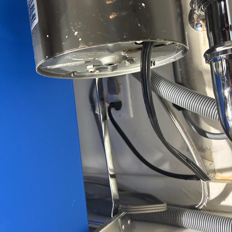 Garbage disposal wiring and plumbing connections under sink