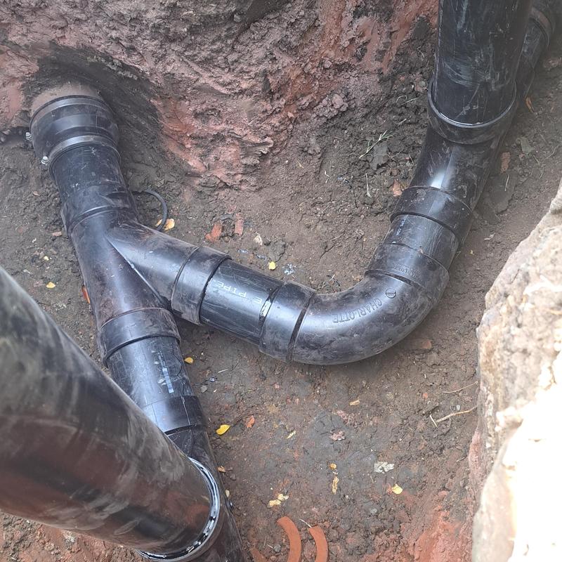 Sewer cleanout installation with PVC piping in soil Sewer cleanout installation with PVC piping in soil