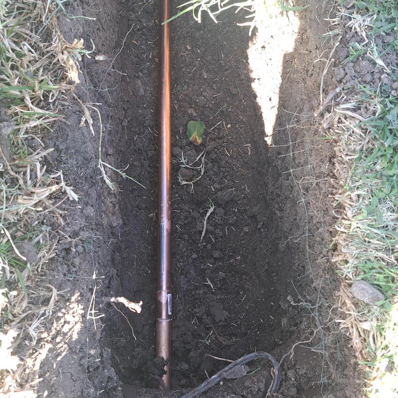 Copper water main pipe in trench installation Copper water main pipe in trench installation