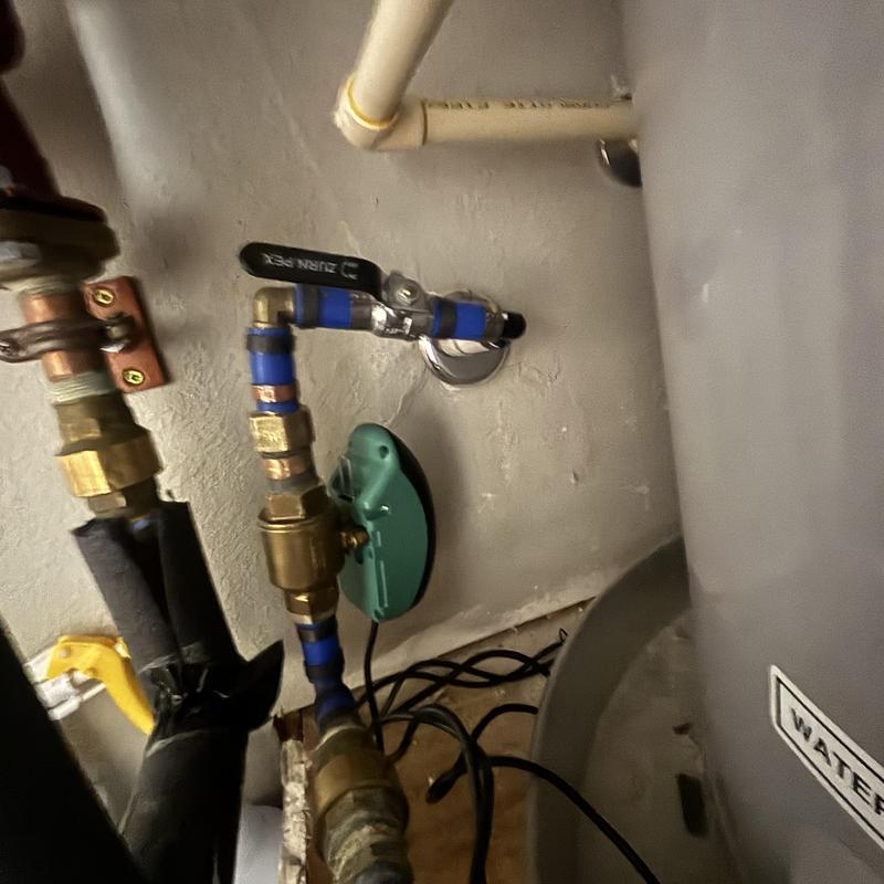 Water heater leak breaker installation with valve and piping