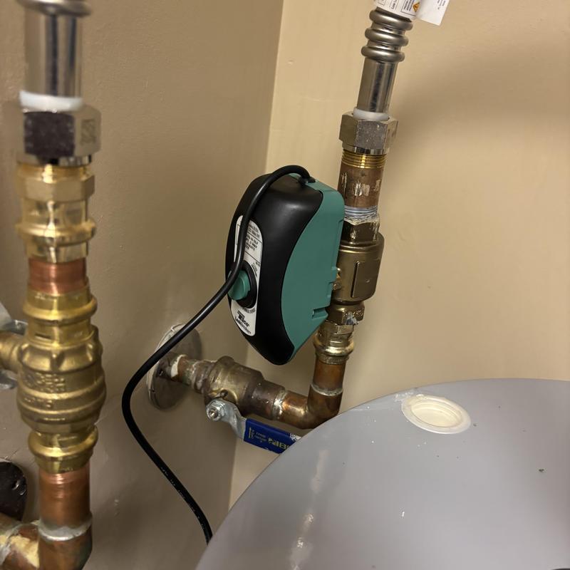 Leak breaker valve on water heater piping installation