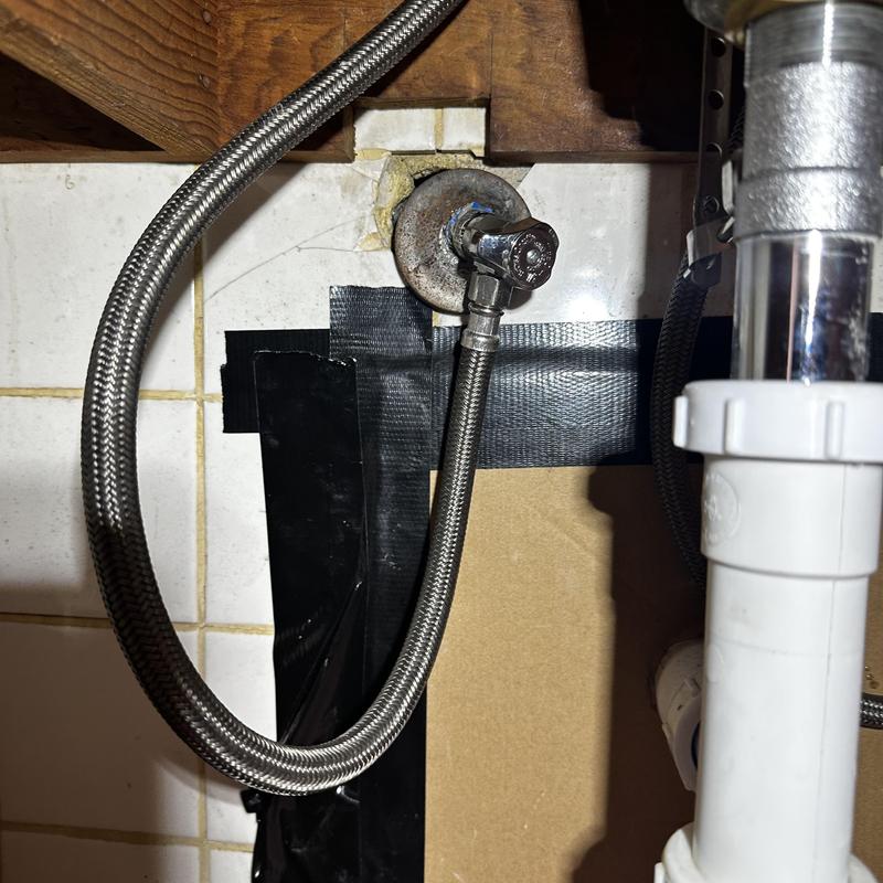 Angle stop valve with braided hose under sink
