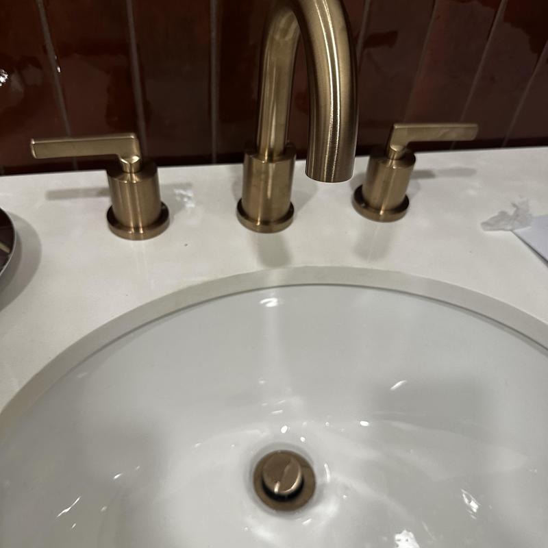 Brass bathroom faucet with tubular drain installation