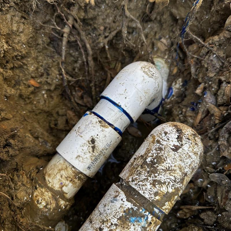 Swimming pool PVC pipe with new elbow fitting in soil