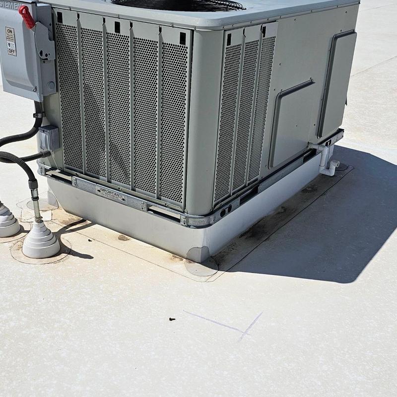 TPO flat roof with HVAC unit and patched seams TPO flat roof with HVAC unit and patched seams