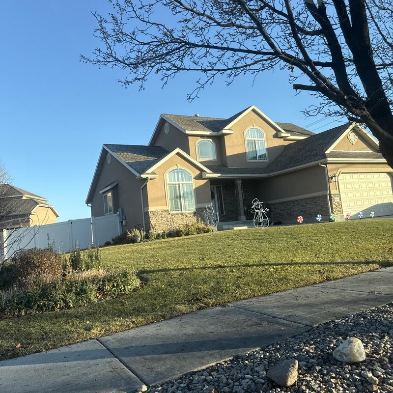 Asphalt shingle roof on two-story home exterior Asphalt shingle roof on two-story home exterior
