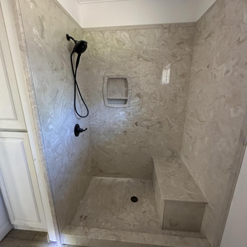 Groutless custom shower unit with bench and hand shower Groutless custom shower unit with bench and hand shower