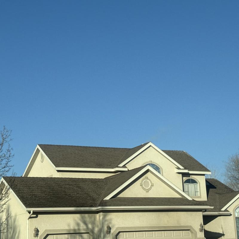Asphalt shingle roof installation on residential home Asphalt shingle roof installation on residential home