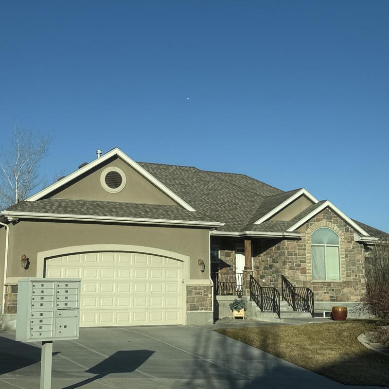 Asphalt shingle roof on suburban home in West Valley City Asphalt shingle roof on suburban home in West Valley City