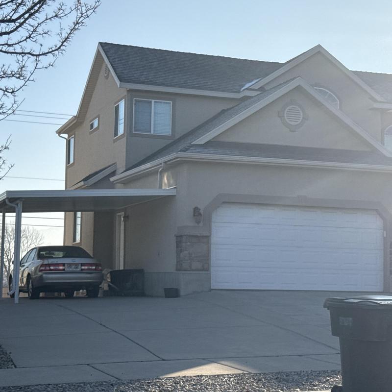 Asphalt shingle roof on residential home in daylight Asphalt shingle roof on residential home in daylight
