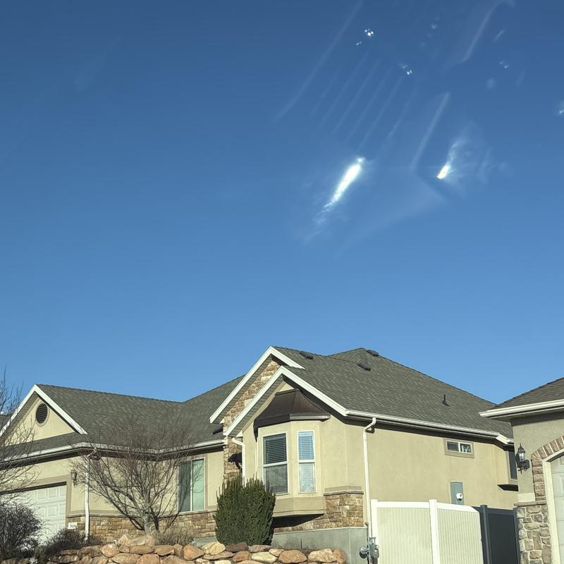 Asphalt shingle roof installation on residential house Asphalt shingle roof installation on residential house