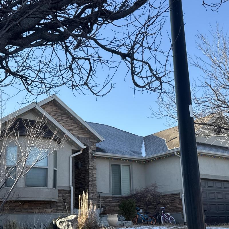 Asphalt shingle roof on residential home Asphalt shingle roof on residential home