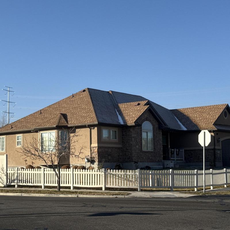 Asphalt shingle roof on residential home exterior Asphalt shingle roof on residential home exterior