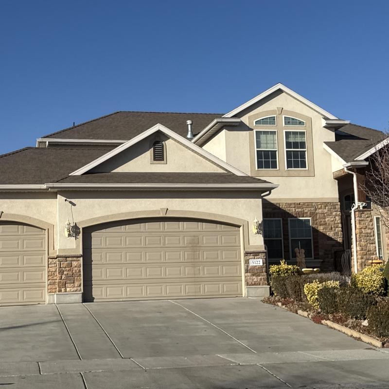 Asphalt shingle roof on residential home exterior Asphalt shingle roof on residential home exterior