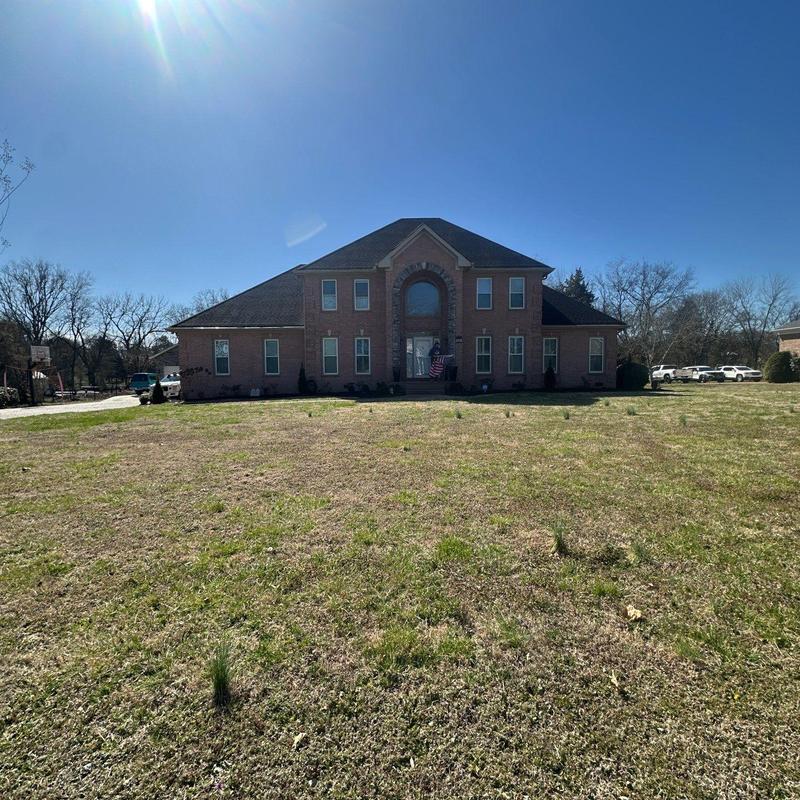 Asphalt shingle roof inspection on brick house
