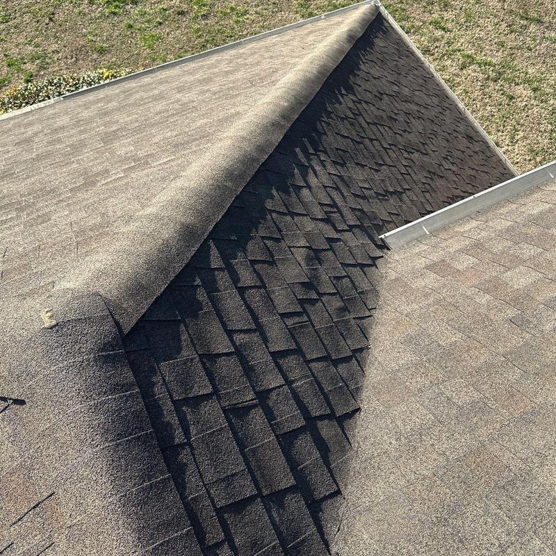Asphalt shingle roof ridge cap inspection and damage