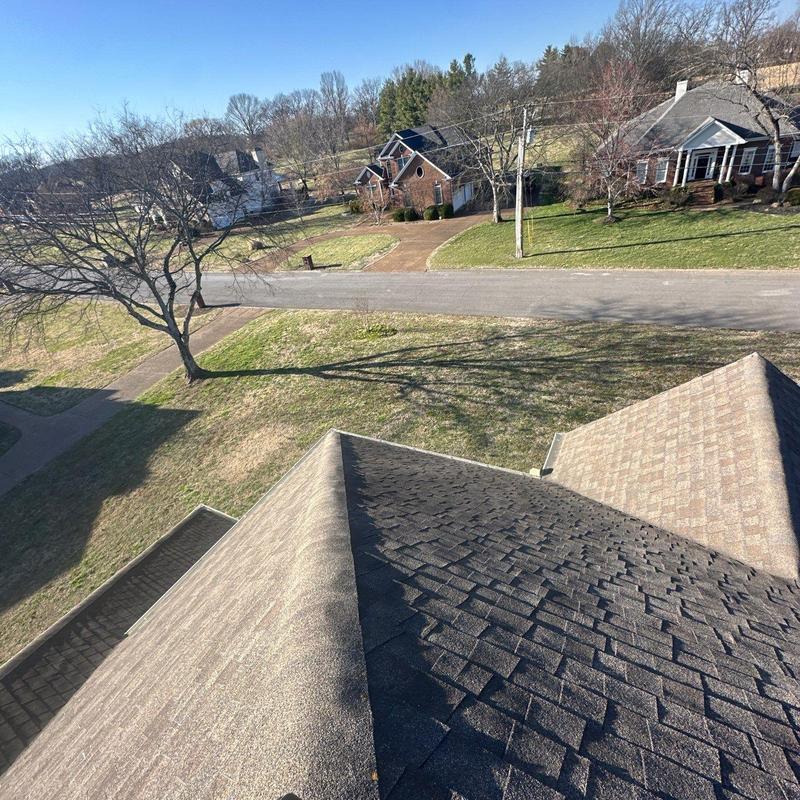 Asphalt shingle roof with ridge cap inspection