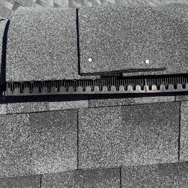 Asphalt shingles with ridge vent and nail heads