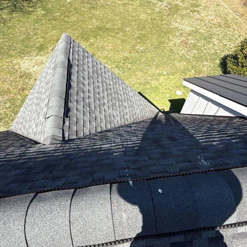 Asphalt shingle roof with hail damage and shadow