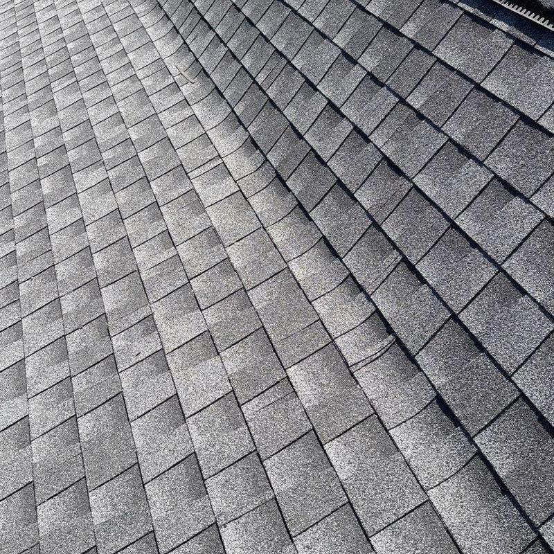 Asphalt shingle roof with hail damage and wear