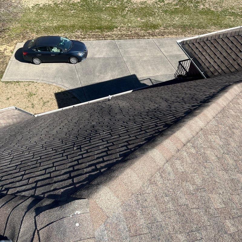 Shingle roof inspection showing hail damage areas
