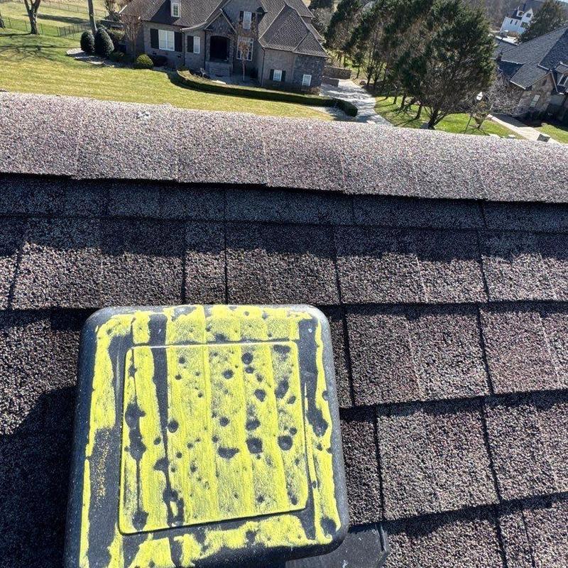 Roof vent with hail damage marked in yellow paint